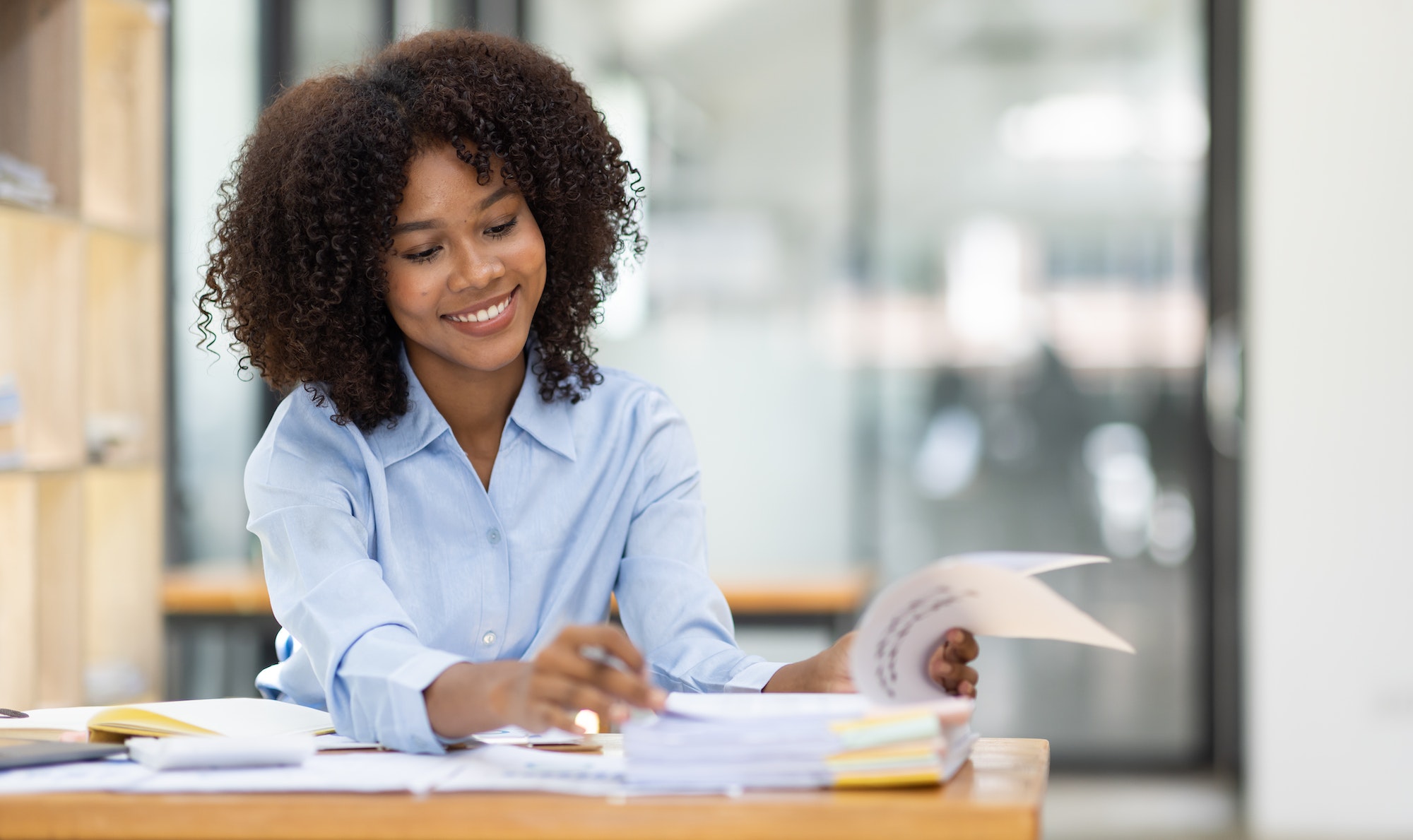 Successful african american accountant business woman work document tax on laptop computer in office